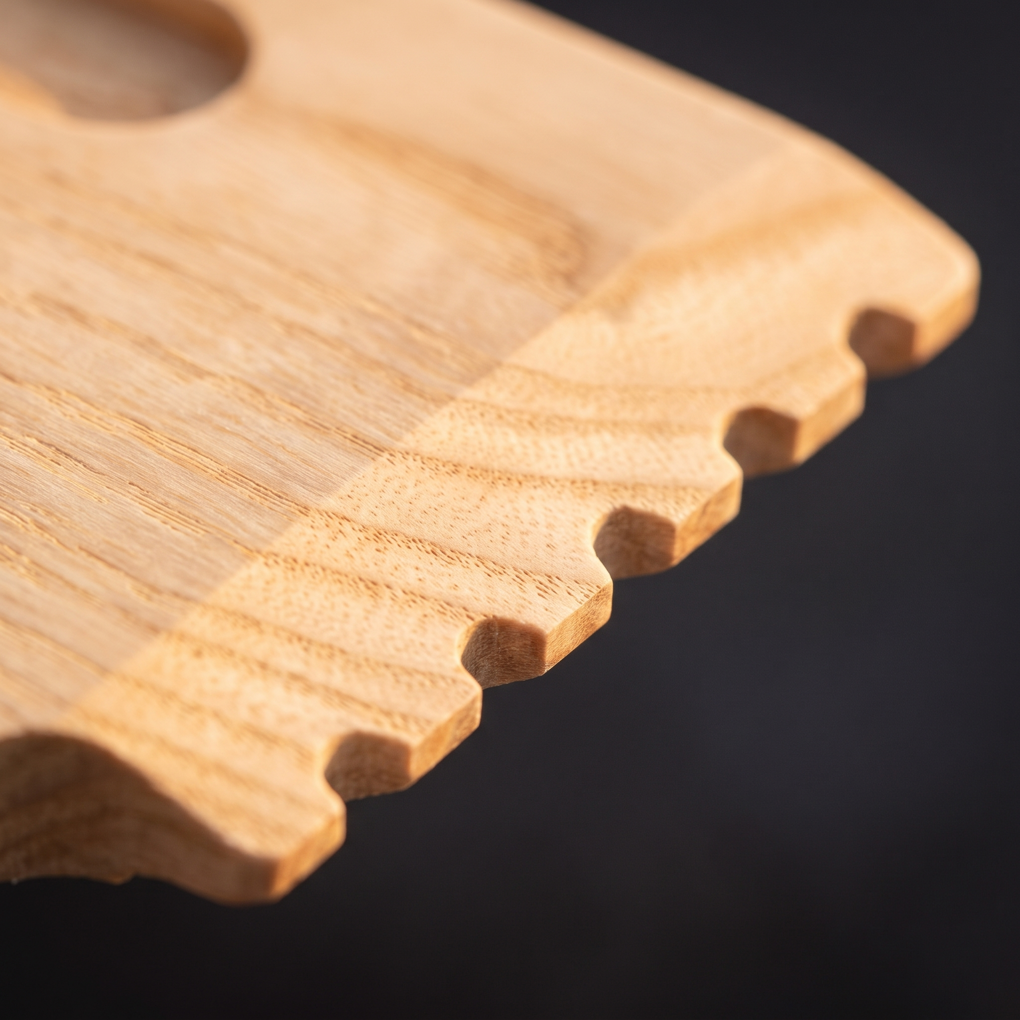 Macro close-up of the Skrapa serrated hardwood scraping edge